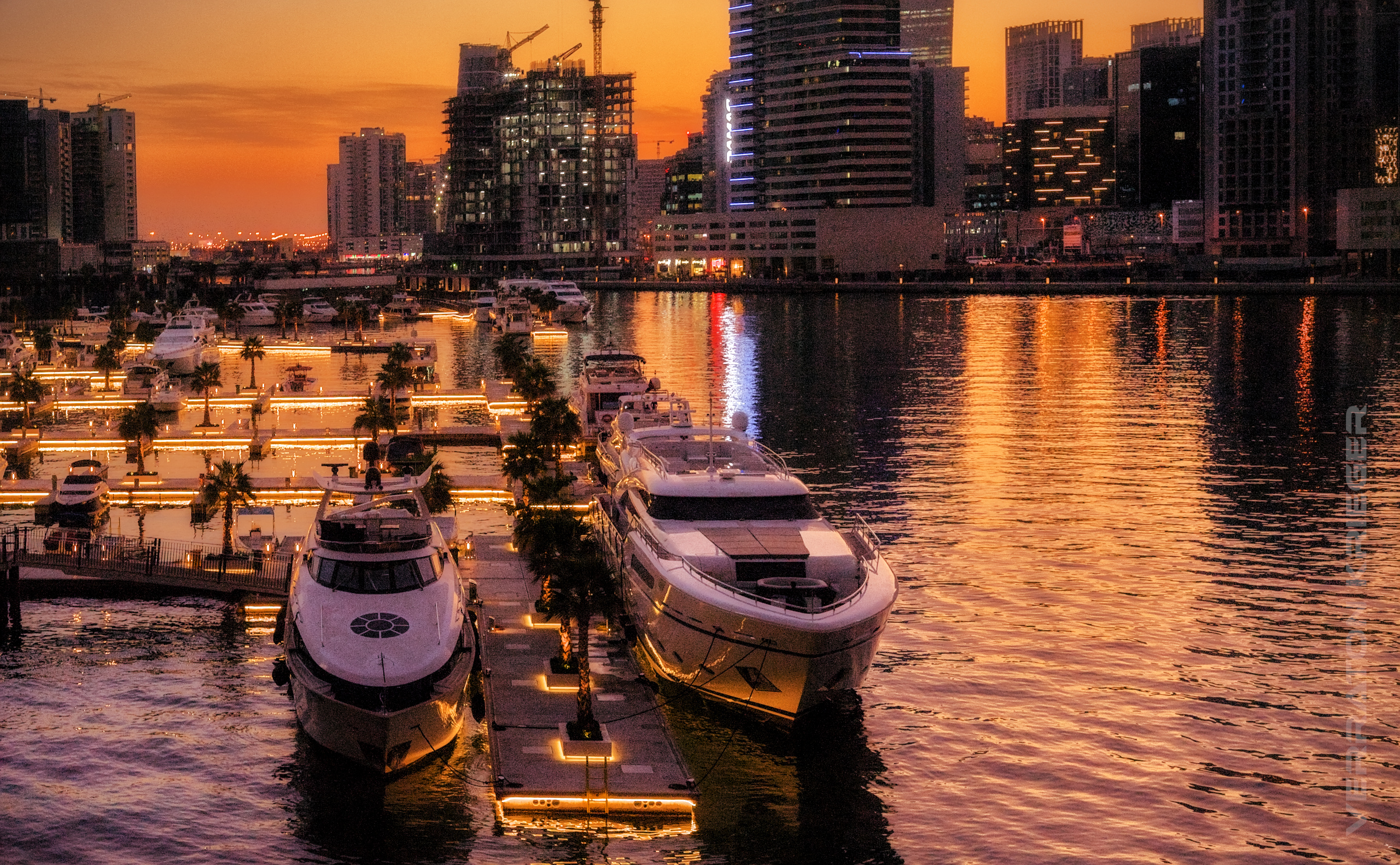 Yachts glimmering in twilight